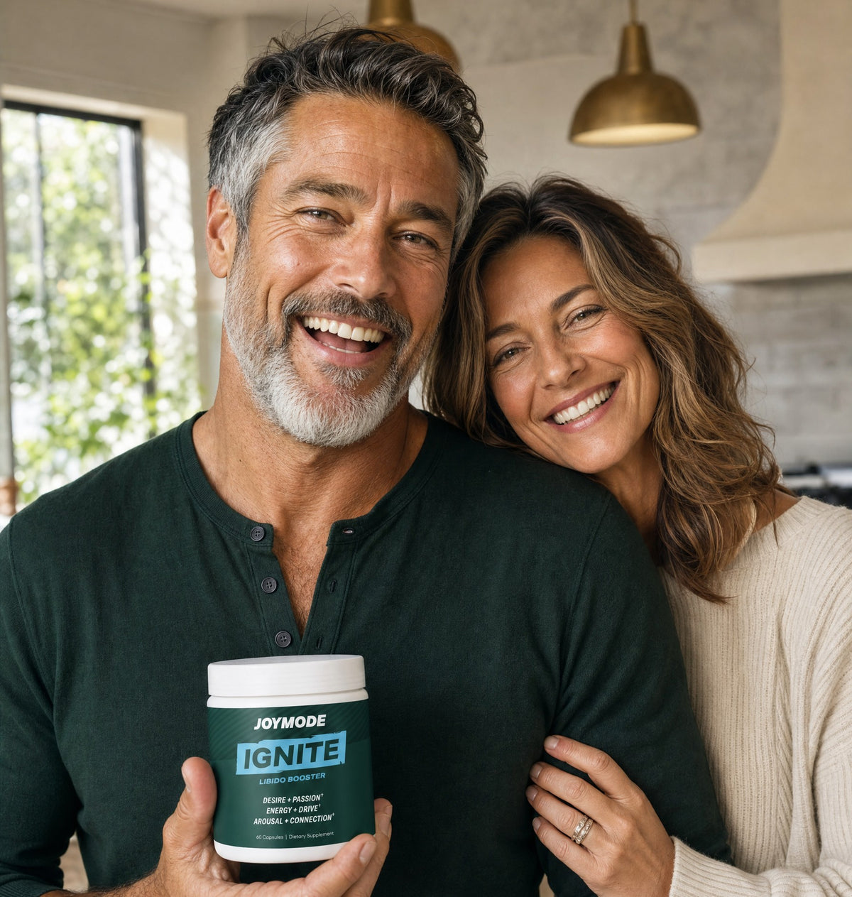 Couple smiling in the kitchen holding Ignite
